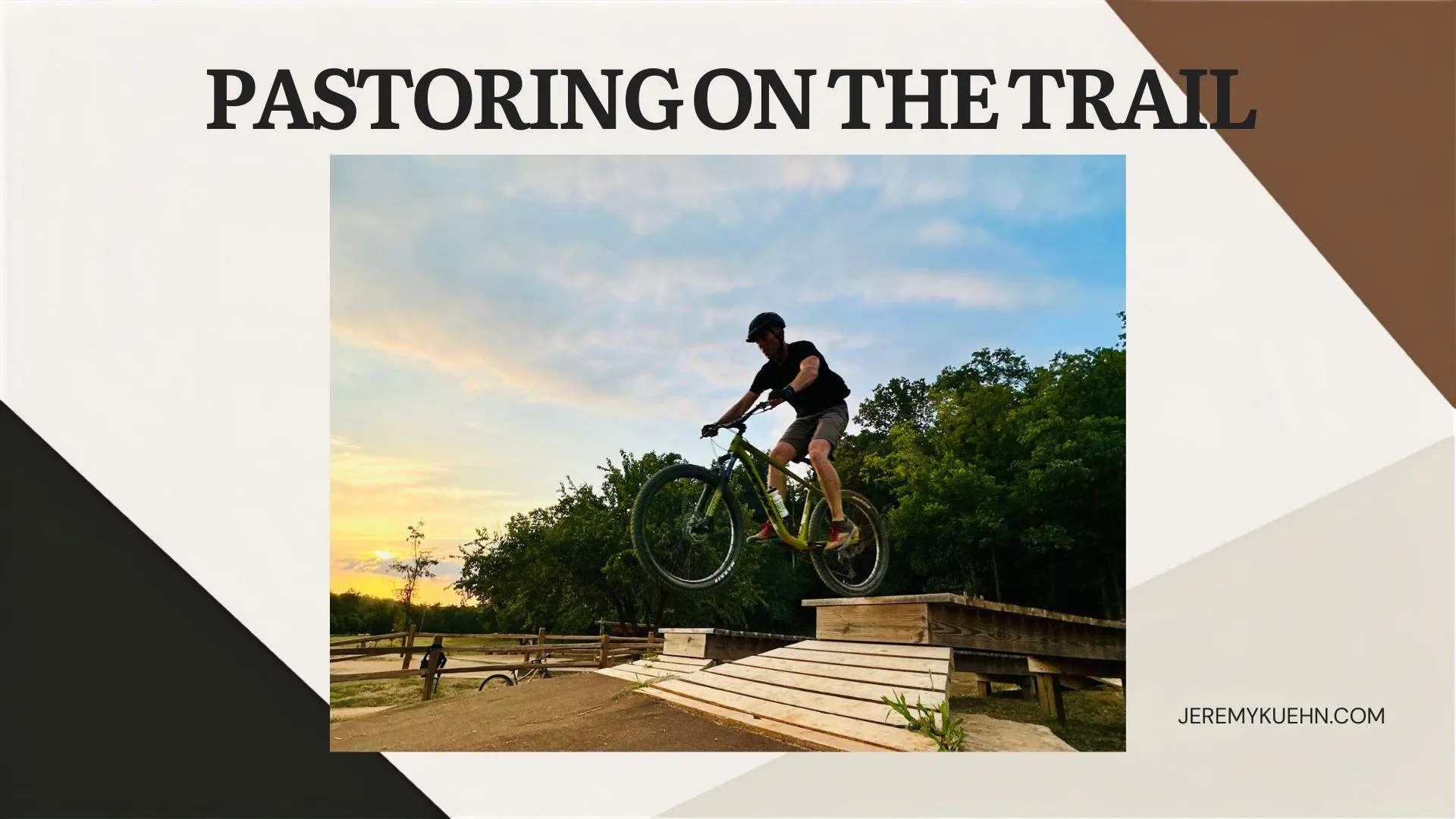 A mountain biker riding a wooden feature at Slaughter Pen Holler in Bentonville, Arkansas, photographed in August 2026.