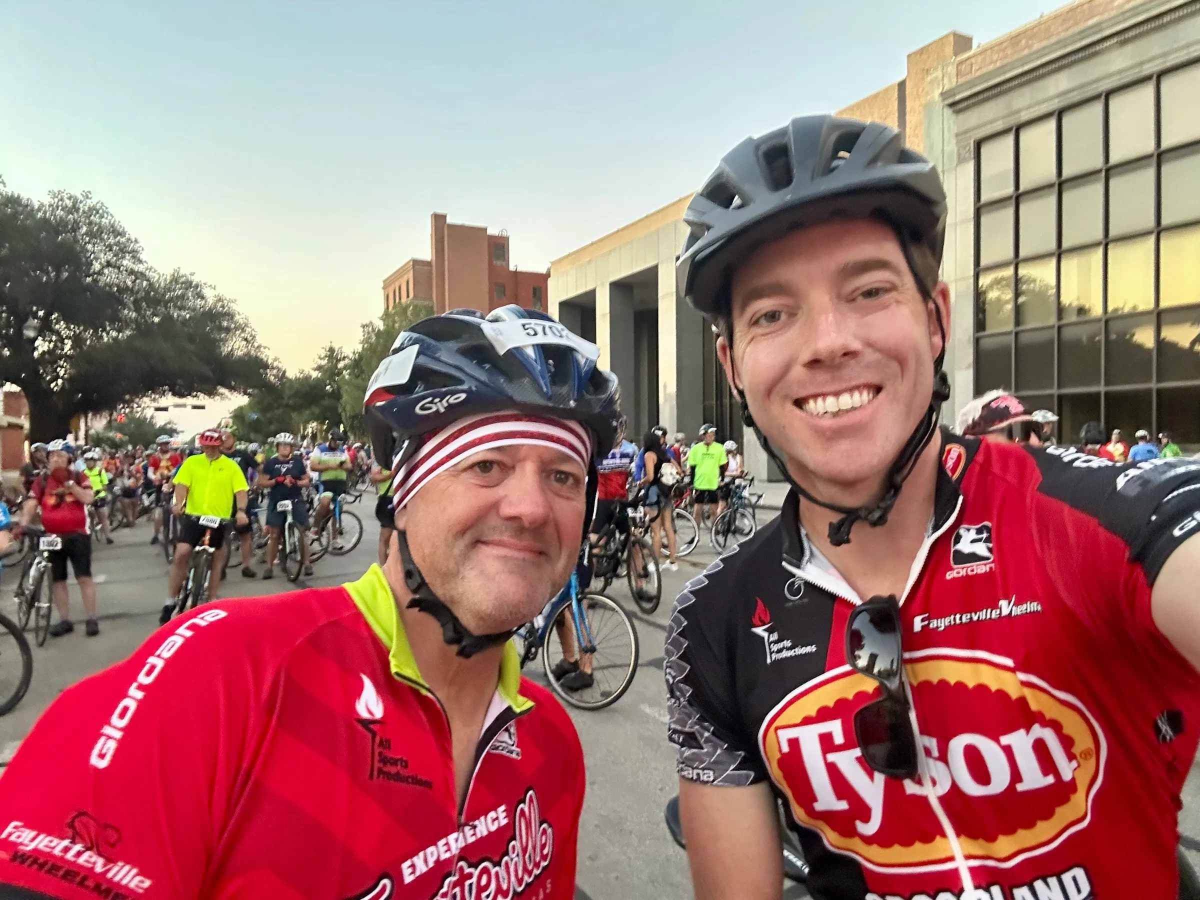 Two cyclists pose for a selfie among riders at the Hotter’N Hell Hundred.
